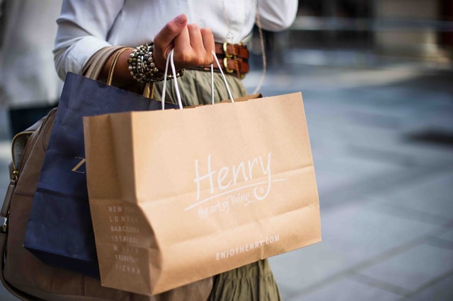 hand holding shopping bag